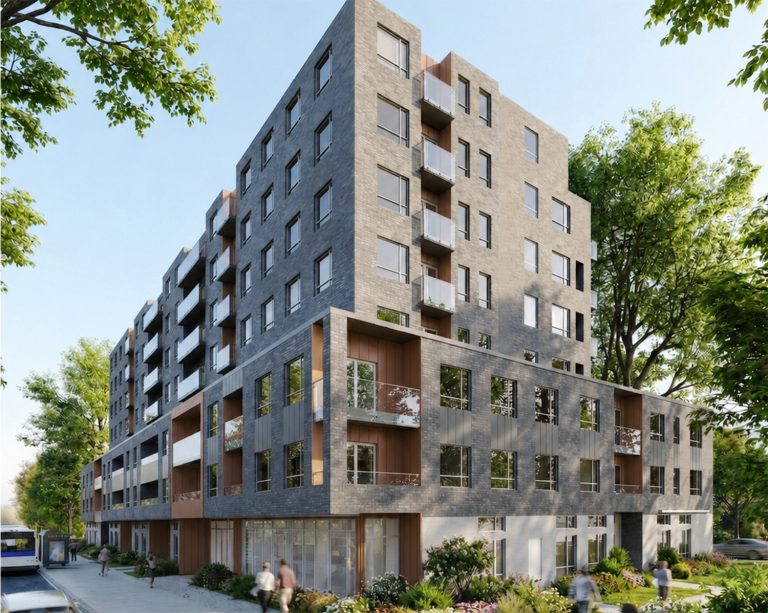 Immeuble résidentiel moderne en brique grise avec balcons et verdure